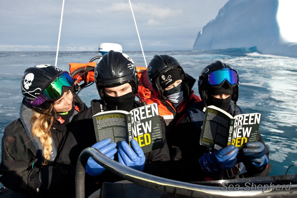 Sea Shepherd crew with books at sea.